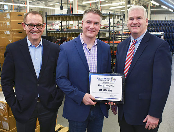 Brian Clark, center, poses with Bob Kill and Congressman Tom Emmer