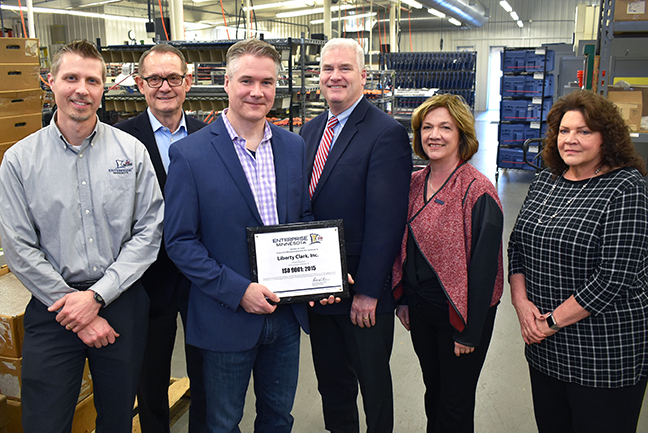 Enterprise Minnesota presents ISO 9001:2015 plaque to Liberty Clark, Inc.