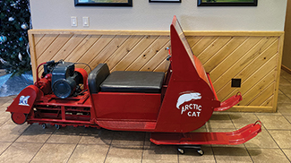 Ericco display of an early Arctic Cat snowmobile