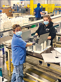 MDI workers assembling products