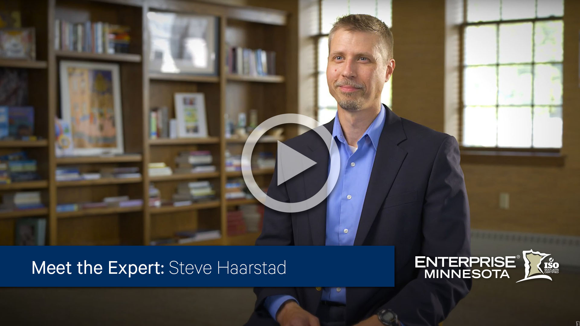 Steve Haarstad sitting in a chair. Click this image to watch his bio video. 