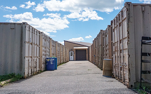 Row of shipping containers at MNSTAR manufacturing. 