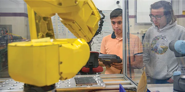 Hennepin Tech - Students using a robotic arm