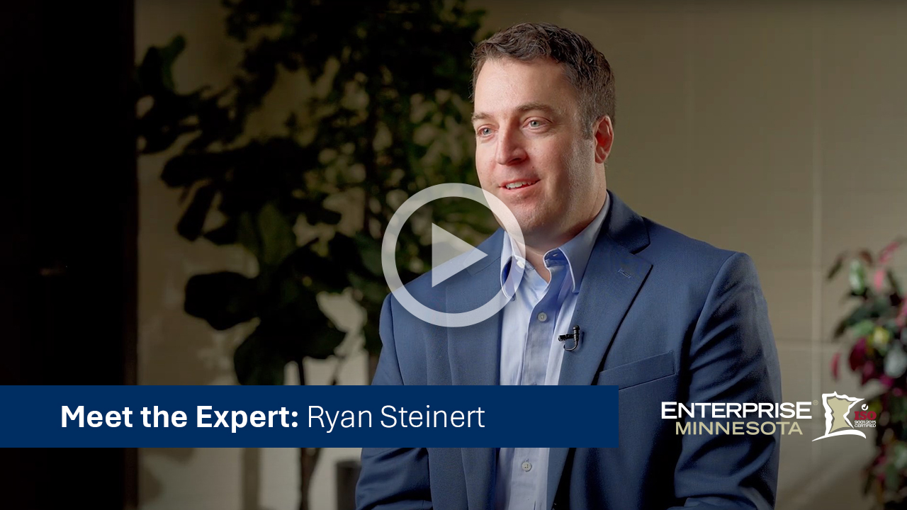 Ryan Steinert sitting in a chair. Click to watch his bio video. 