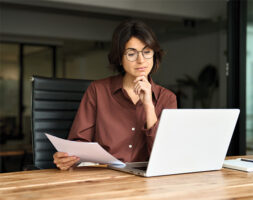 Female executive looking at a computer.