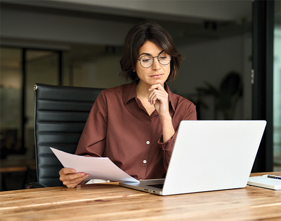 Female executive looking at a computer.
