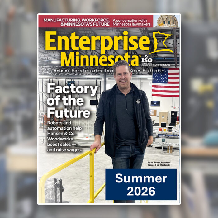 The cover of Enterprise Minnesota magazine's Summer 2026 issue, featuring Hansen & Co. Woodworks founder Adam Hansen on the floor of his new automated facility, with the cover story headline "Factory of the Future."