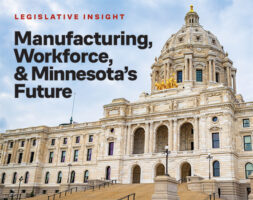 The Minnesota State Capitol building in St. Paul, featuring its large gilded dome and ornate Beaux-Arts architecture against a partly cloudy sky.
