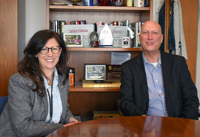 Senator Heather Gustafson and Enterprise Minnesota lobbyist Marty Seifert seated together at a table in a legislative office.