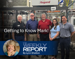 Mark O'Leary standing with other tour participants at Aagard in Alexandria, Minnesota. Overlaid on the image is the text "The Weekly Report".