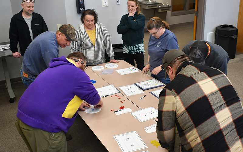 Participants complete a simulation to apply lean concepts learned in the workshop.